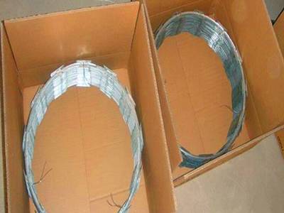 Two rolls of concertina razor wire in two cartons.