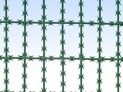 A piece of green color straight razor wire fence with horizontal and vertical razor wire.