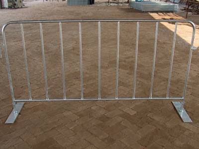 A piece of crowd control barrier with flat removable feet.