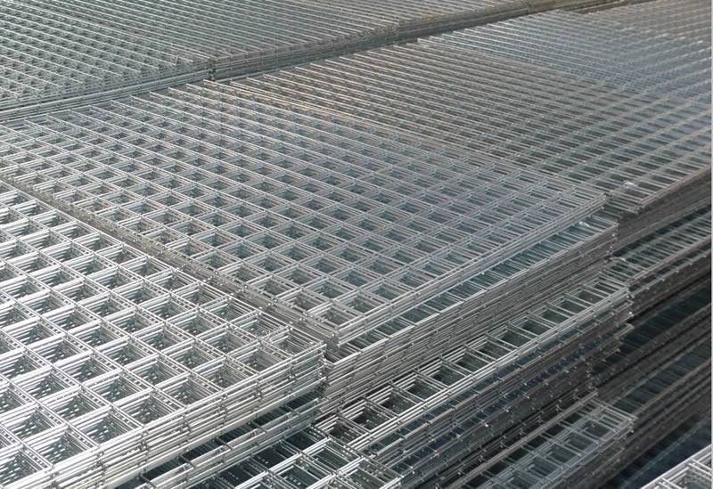 Electro galvanized welded wire square mesh panels in warehouse.