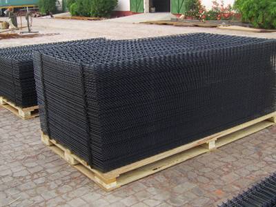 Two pallets of black PVC coated welded wire panels on the ground