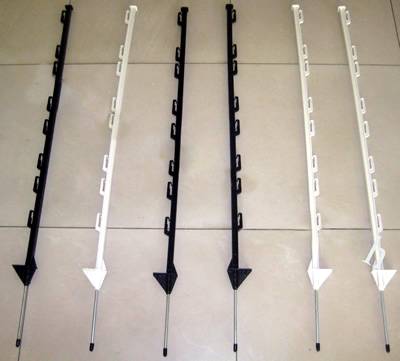 Six white and black colors PP electric fencing posts with single step on the ground.