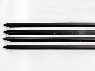 Four black T posts with holes on the surface.