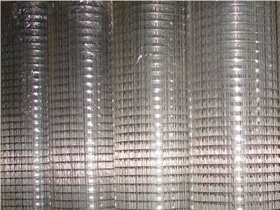 Four rolls of galvanized welded wire mesh packaged in plastic film
