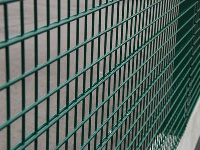 Green PVC coated double wire fence from 868 welded mesh panels.