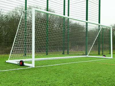 A forest green PVC football fence has different panel height.