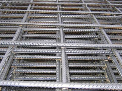 A bundle of welded wire mesh made of reinforced bars on the ground.