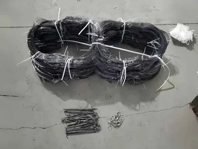 Two packaged obstacles fences and related installation accessories placed on the factory floor