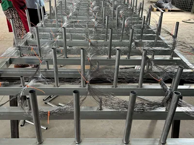 Obstacles fence joined with red cable ties on the workbench