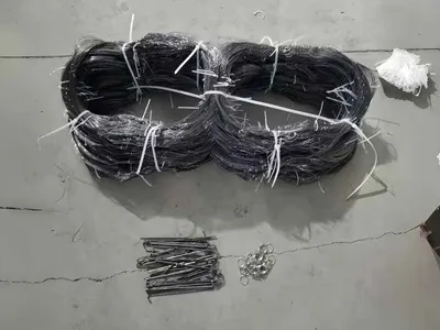 Two packaged obstacles fences and related installation accessories placed on the factory floor