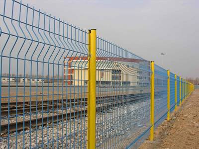 Blue color 3D security fences are installed beside of the railway.