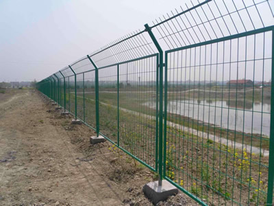 Framework wire mesh fences are installed beside of the river.