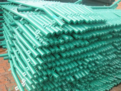 Several PVC coated bending type round post on the ground.