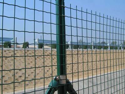 Green Euro fences are installed besides the riverbank.