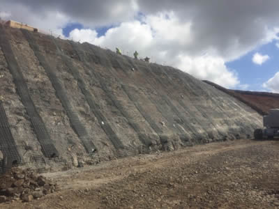 Drain pipe is fixed under the welded wire mesh, which are fixed on a mountain surface.