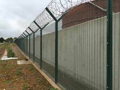 Several pieces of anti-climb fences are installed in the prison with razor wire on the square post.