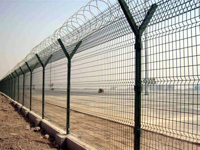 3D security fences are installed outside of the airport with razor wires on the double crank arm square posts.