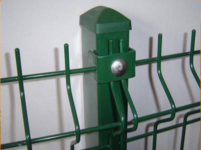 Two green color curvy wire mesh fences are connected by single clip.