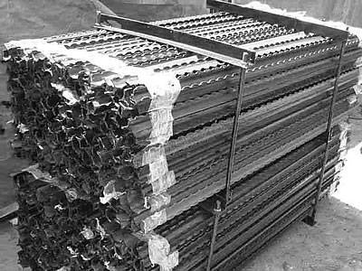 Two pallets of star pickets with teeth on the surface.