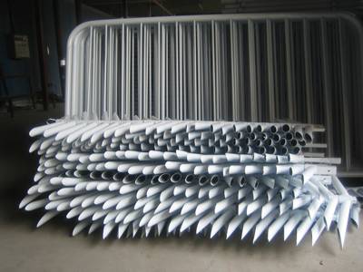 Several bridge feet and crowd control barrier panels in the warehouse.