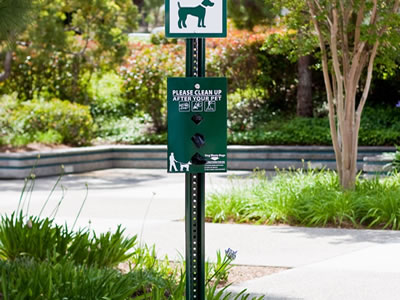 Two sign boards are mounted onto the green color U channel sign post.