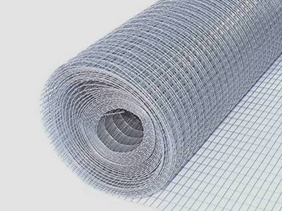 A roll of galvanized welded mesh on the gray background.