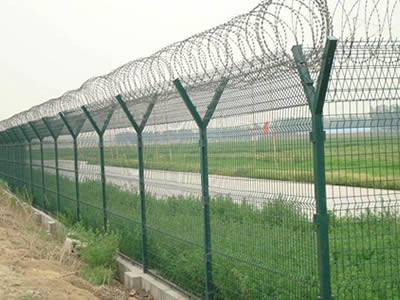 Several welded razor wire are installed surrounding the farmland.