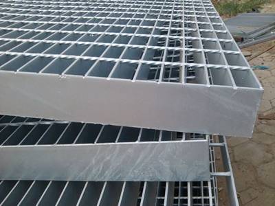 Several welded steel grating on the ground.
