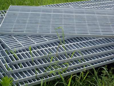 Several close mesh welded steel grating on the ground.