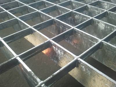 Press locked welded steel grating on the ground.