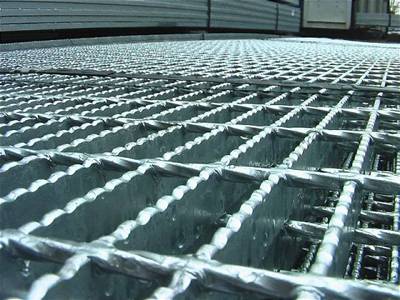 A detail surface of serrated welded steel grating.