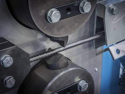 A machine is cutting the reinforced bar.